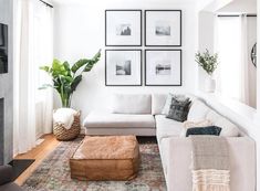 a living room filled with furniture and pictures on the wall above it's coffee table