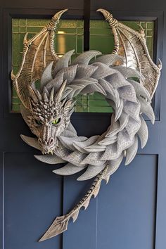 a dragon wreath is hanging on the front door