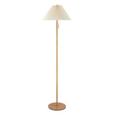 a wooden floor lamp with a white shade