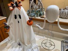 a bathroom decorated for halloween with ghost decorations