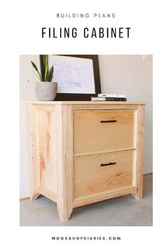 a wooden cabinet with the words building plans filing cabinet on it and a potted plant next to it