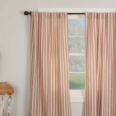 the curtains in this room are striped with red and white stripes