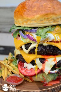 a cheeseburger with fries and ketchup sits on a wooden platter