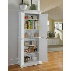 an open refrigerator with its door wide open and shelves full of food, including milk, condiments and other items