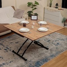 a living room with a couch, coffee table and other items on the carpeted floor