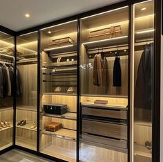 a walk in closet filled with lots of clothes