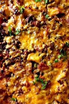 a casserole dish with meat, cheese and vegetables on it's side