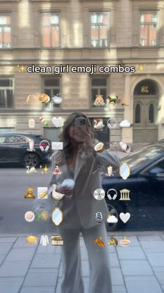 a woman standing in front of a building with many stickers on her face and the words clean girl emoji combos