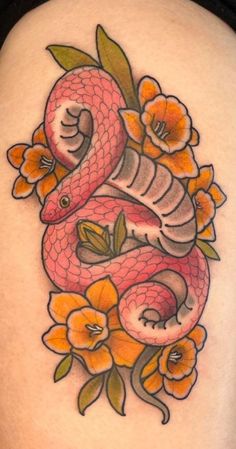 a woman's thigh with a snake and flowers on it