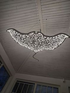 an intricately designed light fixture hangs from the ceiling