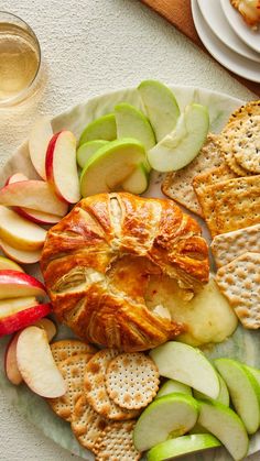 an apple and cracker platter is shown on a plate