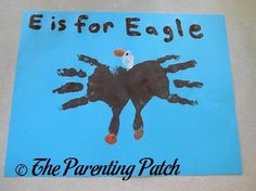 a child's handprint is displayed on a blue sign that says, e is for eagle