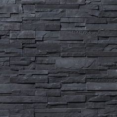 a black stone wall that is very dark