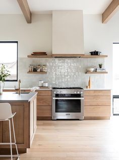 a kitchen with an oven, stove and counter tops