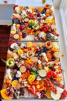 an array of fruits and vegetables are arranged in the shape of a long row on top of each other