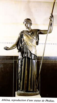 an image of a statue holding a staff