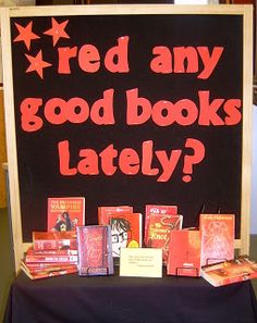 a sign that says red any good books lately? with lots of books on it