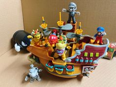 a toy pirate ship with various figures on it