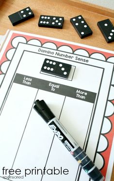 a printable domino board game with dices and markers on the table next to it