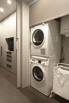 a washer and dryer in a room next to each other on the floor