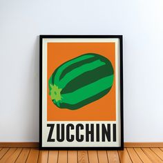 there is a poster with the word zucchini on it in front of a wooden floor