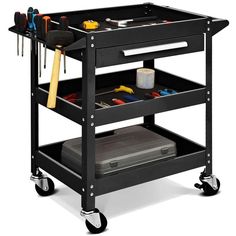 a black utility cart with tools on it and two trays full of different items