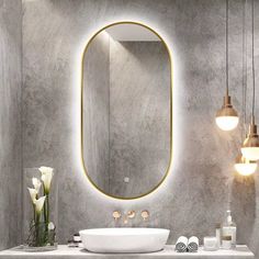 a bathroom with a sink, mirror and lights on the wall next to each other