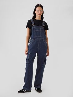 Fit:Overalls that are relaxed all the way down.  Fabric: 95% Cotton, 5% Recycled Cotton.  Stretch: No Stretch Overalls.  Authentic denim that gets better with every wear.  Made to wear all day & break in over time.  Look: A relaxed cargo overall in a rinsed blue wash.  Details: Adjustable racerback straps and front buckles, bib pocket, four-pocket styling, & side cargo pockets.  Responsibly Made: This pair of overalls is part of our water-saving Washwell program.  Compared with conventional wash methods, Washwell uses at least 20% less water and has saved over a billion liters of water since 2016.  * Fit: Relaxed.  An easy silhouette throughout.  Full length.  Models wearing Gap Denim Overalls Outfit, Cargo Overalls, Easy Fits, Types Of Clothing Styles, Overalls Denim, Easy Silhouette, Denim Dungaree, Blue Overalls, Overalls Outfit