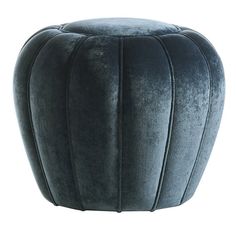 an ottoman that is made out of velvet