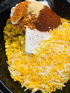 the ingredients for this dish are mixed together in a large skillet, including cheese and seasoning