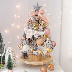 a small christmas tree with ornaments and lights