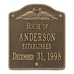 a plaque that reads house of anderson established december 31, 1908 with two birds on it