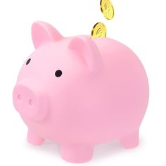 a pink piggy bank with two gold coins coming out of it's mouth