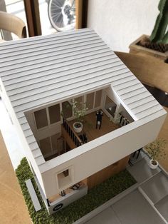 a model house is shown on the table