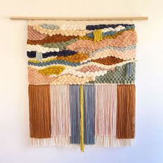 the weaving is hanging on the wall