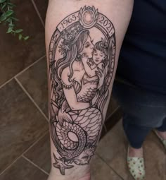 a woman with a tattoo on her arm