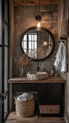 a bathroom with a sink, mirror and basket on the counter in front of it