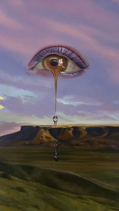 an eye is floating in the sky above a landscape