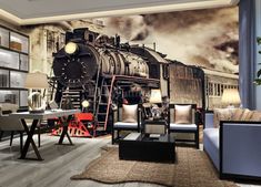 a living room filled with furniture and a train mural