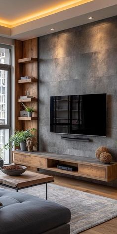 a living room filled with furniture and a flat screen tv on top of a wooden shelf