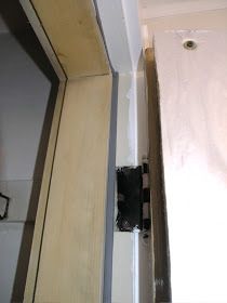 an unfinished bathroom door is shown in this image