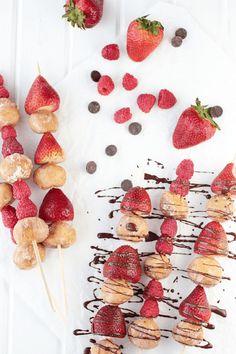 strawberries and bananas on skewers with chocolate drizzle