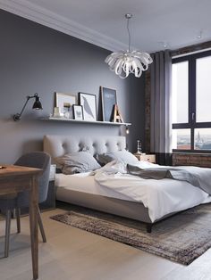 a bedroom with gray walls and white furniture