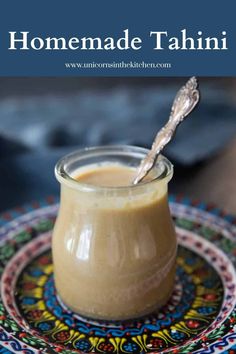 homemade tahitii sauce in a glass jar on a colorful plate with a spoon