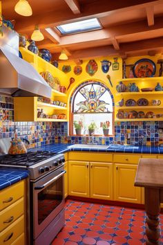 a kitchen with yellow cabinets and blue counter tops is pictured in this image, there are many plates on the shelves above the stove