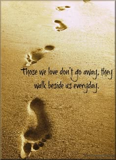 someone is walking on the beach with their footprints in the sand that says, those we love don't go away they walk beside us everyday