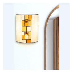 a lamp that is on the wall next to a mirror