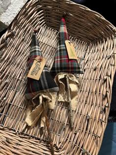 two pieces of cloth sitting on top of a wicker basket