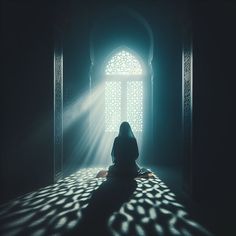 a person sitting on the floor in front of an open window with sunlight streaming through it