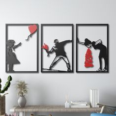 three black and white silhouettes of people holding red balloons in front of a wall